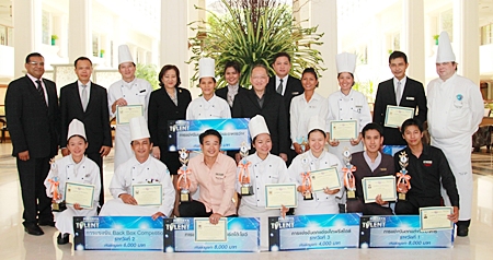 The winners in various categories from the 2011 Pattaya’s Bartender Got Talent Competition show their plaques and trophies as the management of Dusit Thani Pattaya, led by General Manager Chatchawal Supachayanont (centre), proudly pose with them after a small congratulatory ceremony held at the resort. 