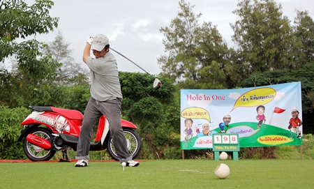 A player tees off hoping to win the Honda Scoopy hole in one prize.