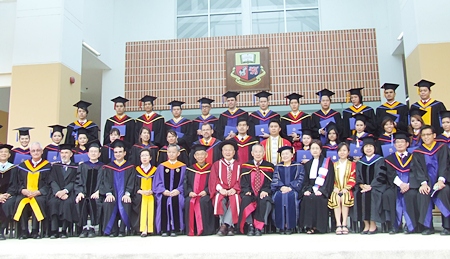 The graduates with the Asian U faculty.