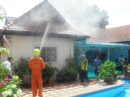 It took firefighters about an hour to fully extinguish the roof fire in Banglamung. 