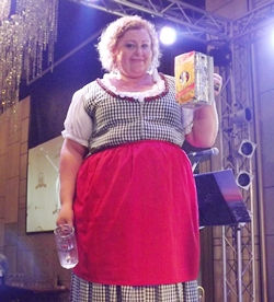 Peta Ruiter, the beer guzzling champion proudly holds up her trophy.
