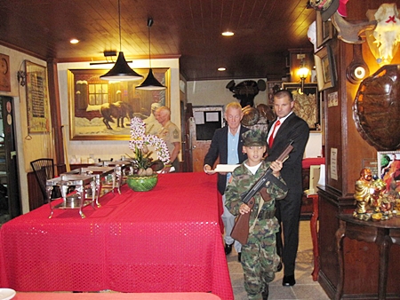 Young Marines’ Pvt. Bret Mays leads out Cake Detail at the 236th U.S. Marine Corps Birthday Ball held in Pattaya at the Cafe Kronborg on 11 Nov. 2011. (L to R)  The Oldest Marine GySgt Billy Goodman born 2 April 1927, Young Marines’ Pvt Bret Mays born 1 April 2002 and the Youngest Marine was Sgt David Dziabo born 10 July 1981.
