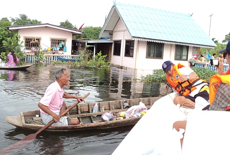 People make their way to the evacuation centre in Ayuthaya, Preedee Bridge, any way they can.