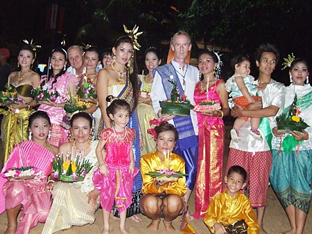 Locals and visitors dressed in Thai traditional clothes enjoy the festival in Jomtien Beach.