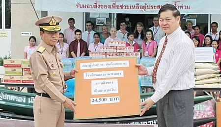 Mr. Prakong and Mr. Goldsack handed out donations to the general.