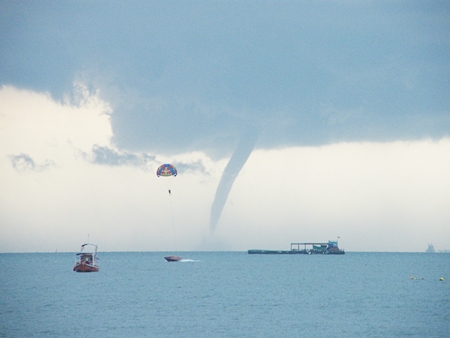 Jet skis and boat operators headed for shore when this monster waterspout showed up in Pattaya Bay on Wednesday afternoon, Oct. 26.  Waterspouts are usually weaker than their land-based cousins, the tornado, but can be dangerous nonetheless. 