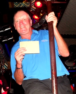 Pole swinger Bob Newell picks up a near pin prize.