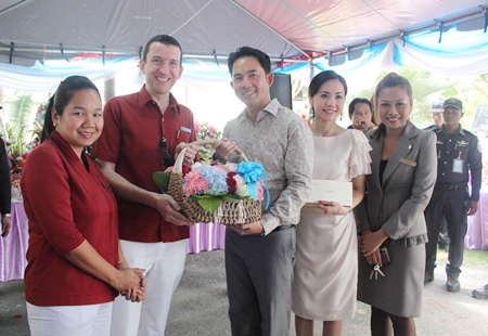 Michael Delargy (2nd left), GM of the Sheraton Pattaya Resort, together with Rojjana Franzke (left), executive assistant manager and Penpapasorn Eamsa-ard (right), senior sales manager presents a gift to Mayor Itthiphol Kunplome and his wife Rachada Chatikavanij (2nd right) on the occasion of his birthday which was celebrated at his home earlier this month. 