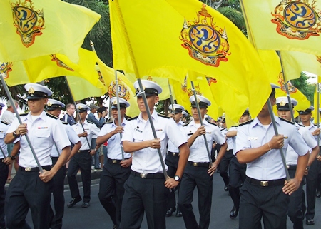 Raja Navy Commercial School cadets proudly fly HM the King’s special birthday flag during the parade down Pattaya Beach Road.