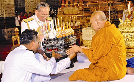 His Majesty the King attends a merit making ceremony for deceased royal family members at the Audience Hall of Amarindra Vinitchai at the Royal Palace Thursday, June 8, 2006, in Bangkok. 