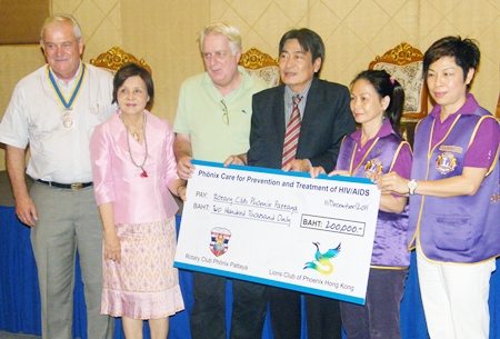 The benevolent groups donate 200,000 baht to Dr. Philippe Seur.