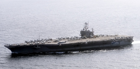 Official U.S. Navy file photo of the Nimitz-class aircraft carrier USS Abraham Lincoln (CVN 72) underway in the U.S. 7th Fleet area of responsibility as part of a deployment to the western Pacific and Indian Oceans en route to support coalition efforts in the U.S. 5th Fleet area of responsibility. (U.S. Navy photo by Mass Communication Specialist 3rd Class Adam Randolph/Released) 