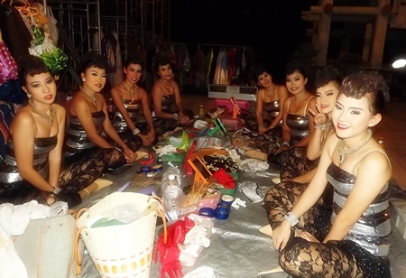 Lovely dancers await their turn to take the stage at Lan Pho Public Park in Naklua.