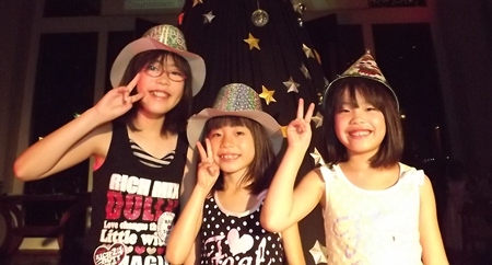 Youngsters salute the New Year at Town in Town Hotel.