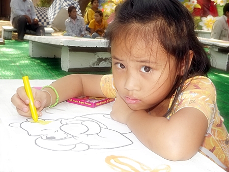 This little one is coloring inside the lines during one of the many activities held throughout Pattaya for this year’s Children’s Day.  Prime Minister Yingluck Shinawatra advised Thailand’s children to obtain “Unity, knowledge, and wisdom, whilst preserving Thai identity and learning technology” in her message to children on this special day. 