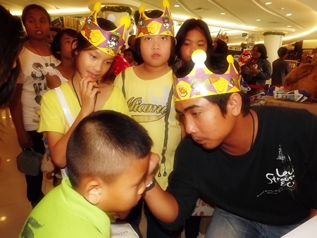 Having your face painted is a time honored ritual on Children’s Day at the Royal Garden Plaza.