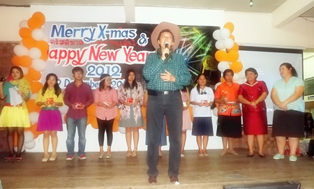 Principal Visanu Phasomzup welcomes everyone to the party and thanks them for their hard work during the past year. 