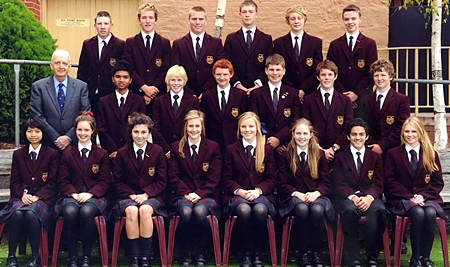 Mick, second left middle row, with his classmates at Girton Grammar School.