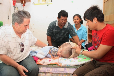 Thanks to American Dr. Howard Resnick (left), young Nopakorn might actually have a future filled with much less pain and suffering.