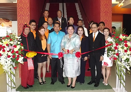 Culture Minister Sukumol Kunplome cuts the ribbon to officially open the new Miniature Thai Royal Barge Performance Center. 