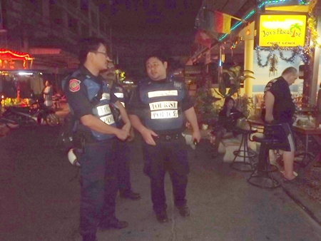 Tourist police volunteers patrol Jomtien Beach bars to give holiday revelers a greater sense of security. 