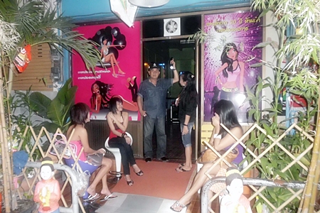 Banglamung Police Superintendent Col. Somnuk Changate (center) leads an inspection of Naklua karaoke bars. 