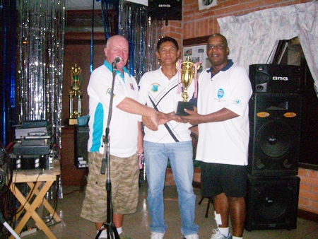 Banksie (center) and Dennis (right) receive the Friday doubles league trophy.