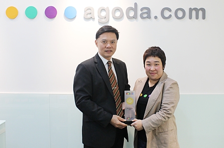 Nijjaporn Marprasert (left), general manager of the Siam Bayview Pattaya receives the ‘Gold Circle Award 2011’ from Thanita Chinabunchorn (right), market manager-hotels of the global hotel booking site, Agoda Company Pte., Ltd. The hotel was selected as one of the top winners of overall room night productivity as voted on Agoda’s online service, popularly reviewed by cyber explorers all over the world.
