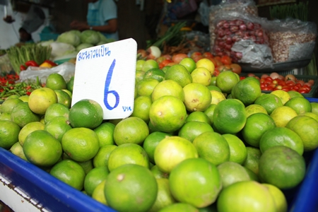 An after effect of last year’s major flooding has been increased inflation, including limes such as these at the Naklua market. 