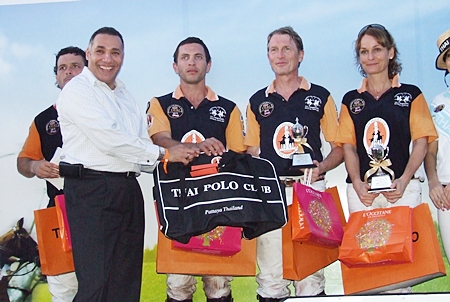 Runners-up Thai Polo are congratulated by Saudi Arabian Charge D’Affaires H.E. Nabil Hussein Ashri (left).