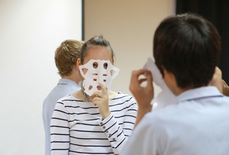 An IB student tries out a mask.