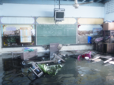 Inside a classroom once the floods started subsiding, but the high water mark can still be seen on the blackgboard.