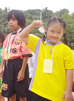 Event winners show off their medals.