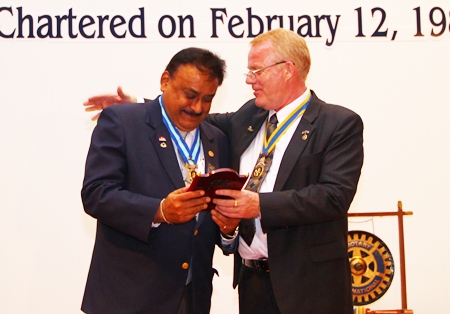 President Gudmund presents an Outstanding      Service Above Self award to PDG Peter Malhotra for 25 years of dedicated service to Rotary, as charter member, President (twice) and District Governor.