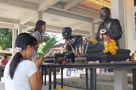 People pay homage to the most revered monks at Wat Nong - Or, Central Pattaya. 