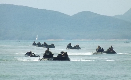 Amphibious vehicles bring troops ashore in Sattahip.