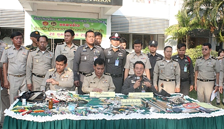 Officers display the cache of drugs, weapons and other paraphernalia confiscated during a search of Pattaya Remand Prison in Nong Plalai. 