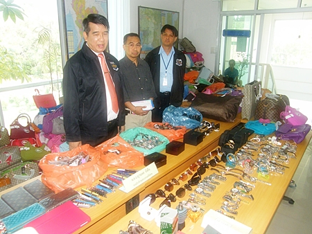 Police lay out for display some of the goods confiscated in what they are billing as the largest ever haul of counterfeit goods on the Eastern Seaboard. 
