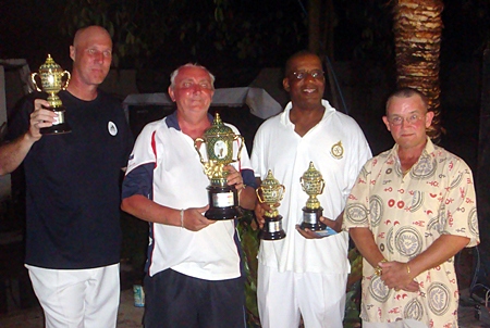 Tournament winners Frank, Dave and Dennis pose for a photo with ‘Rolex’ (right).