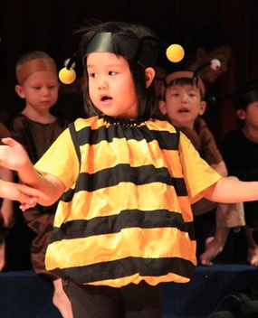 Singing a little bee song.
