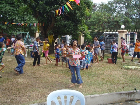 After the celebrations, the children have fun throwing water all over each other.