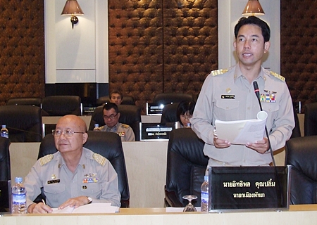 Mayor Itthiphol Kunplome (standing) addresses the Pattaya City Council. 