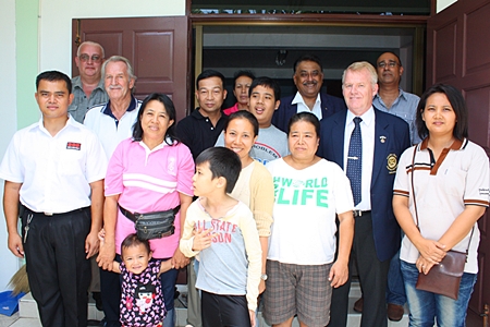 Members of the Pattaya Relief Group together with volunteers and their children at the center are all smiles during the official handover. (l-r) Samran Naepong (ESC) Steve Graham (MD ESC), William Macey (PSC), Pol. Lt. Col. Preecha Samrit, (5th left), Peter Malhotra (4th right), Gudmund Eiksund, (3rd right) President Rotary Club of Jomtien-Pattaya, Korn Kitja-amorn (2nd right) and Supang Samrit (right) director of the ALSC.