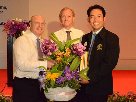 (L to R) David Cumming, general manager Amari Orchid Pattaya, and Simon Landy, chairman of the British Chamber of Commerce Thailand, present Mayor Itthiphol Kunplome with a gift of appreciation for taking time to address the chambers.