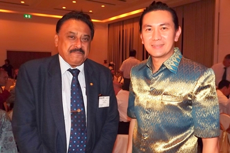 Peter Malhotra (left), managing director of Pattaya Mail, poses for a photo with Saksit Potisit, spokesman for City Hall.