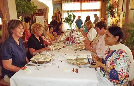 After a strenuous day, the Rotary spouses sit down to an exotic meal at Indian by Nature.