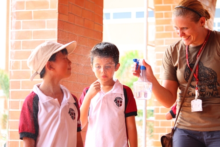 No, it’s not Songkran; it’s a teacher making sure the students don’t overheat.