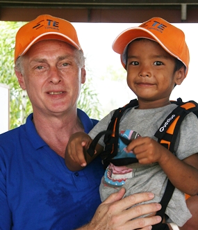 Tom Whelan, VP at TE Connectivity, with one of the younger residents at the Father Ray Children’s Village.