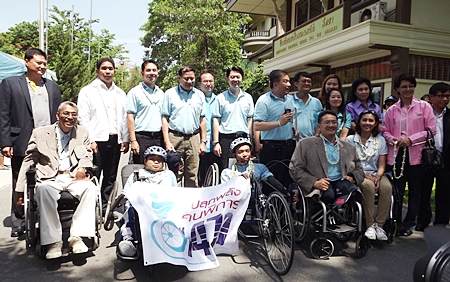 Local officials, including Capt. Pisan Wattanawongsiri (back row, 4th left), honorary consultant of Redemptorist  Center for People with Disabilities, launch the ceremony. 