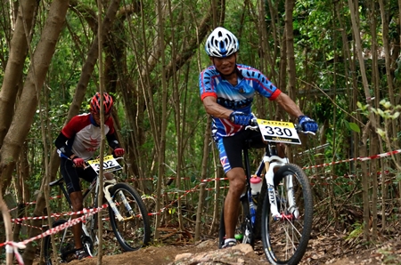 Cyclists get to grips with one of the tough off-road sections.